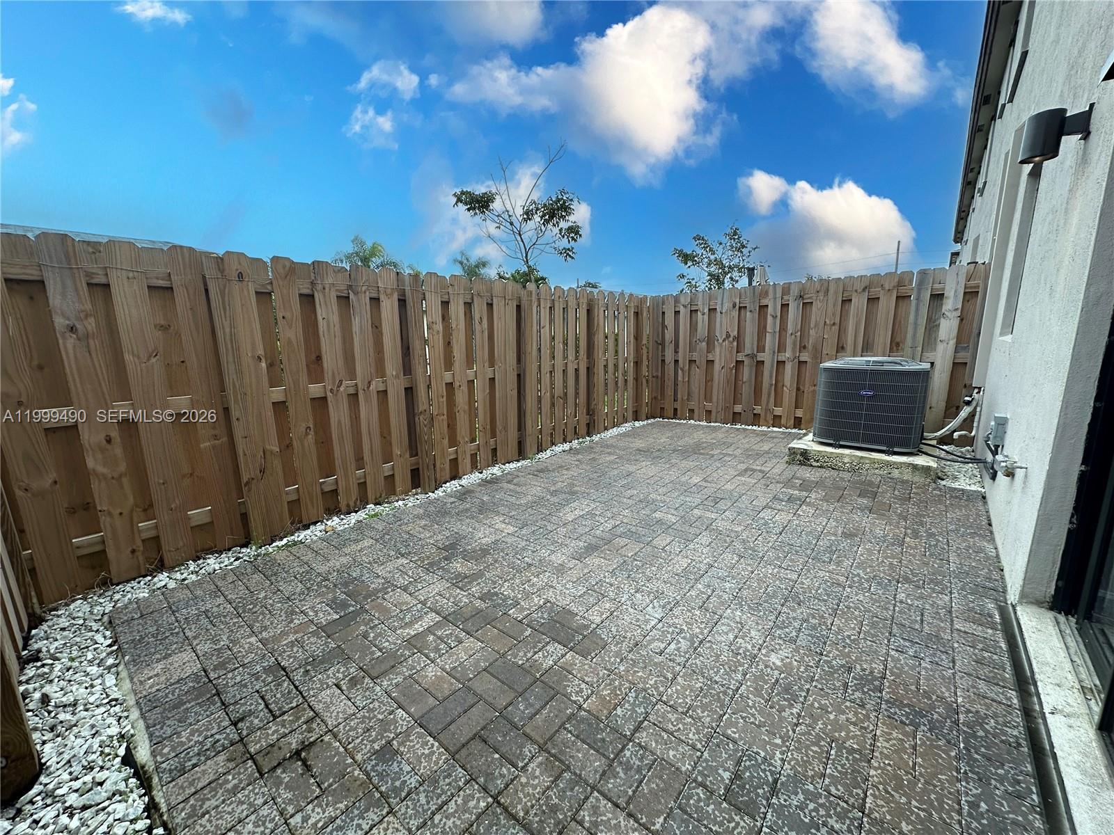 949 Northeast 211th Street Miami, FL 33179 - Photo 10 of 27 a view of backyard with wooden fence