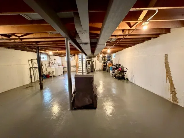 a view of a two chairs on the roof deck