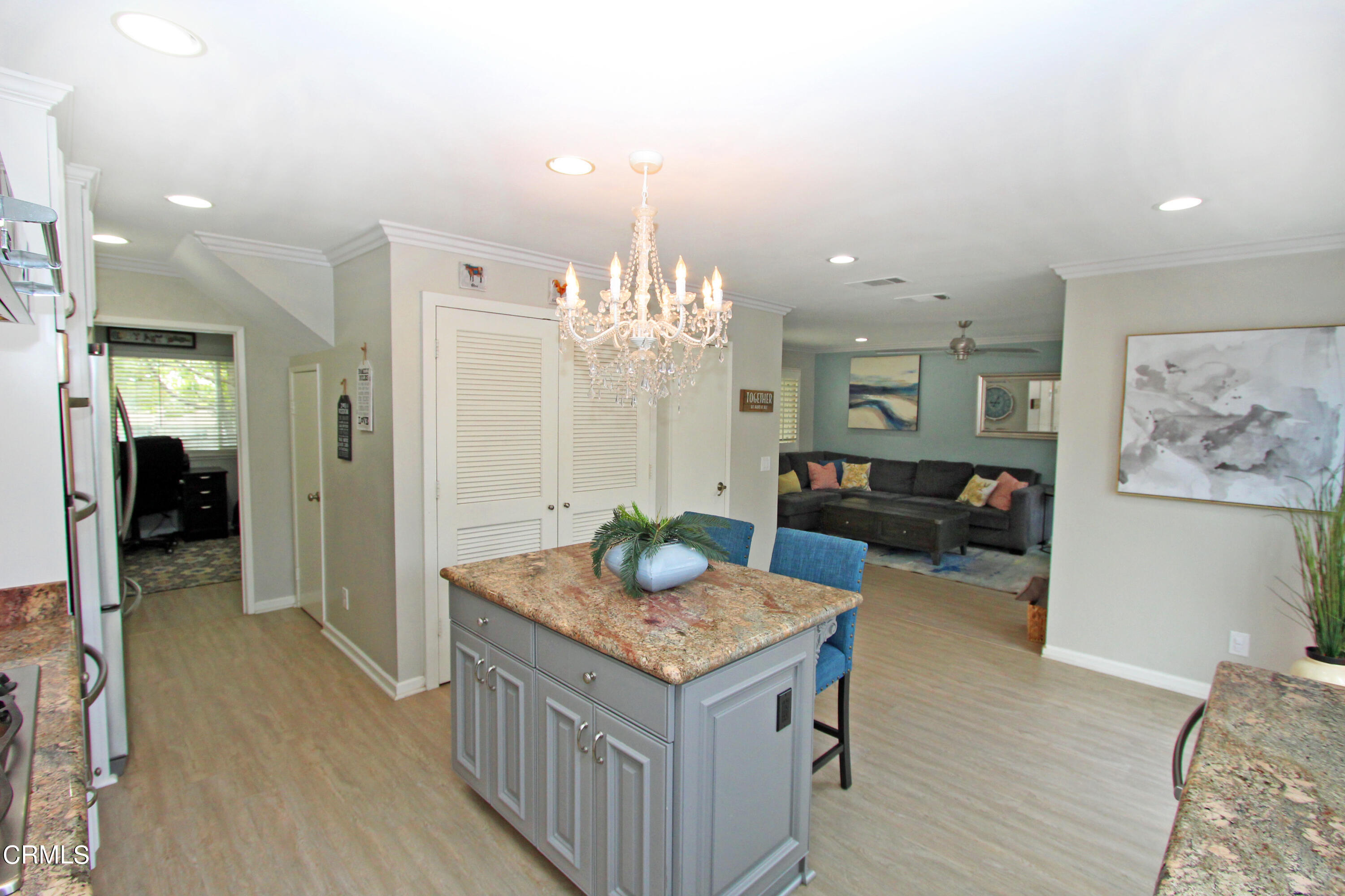 15030 Reedley Street, Unit C Moorpark, CA 93021 - Photo 11 of 51 a bathroom with a granite countertop sink a mirror and a shower