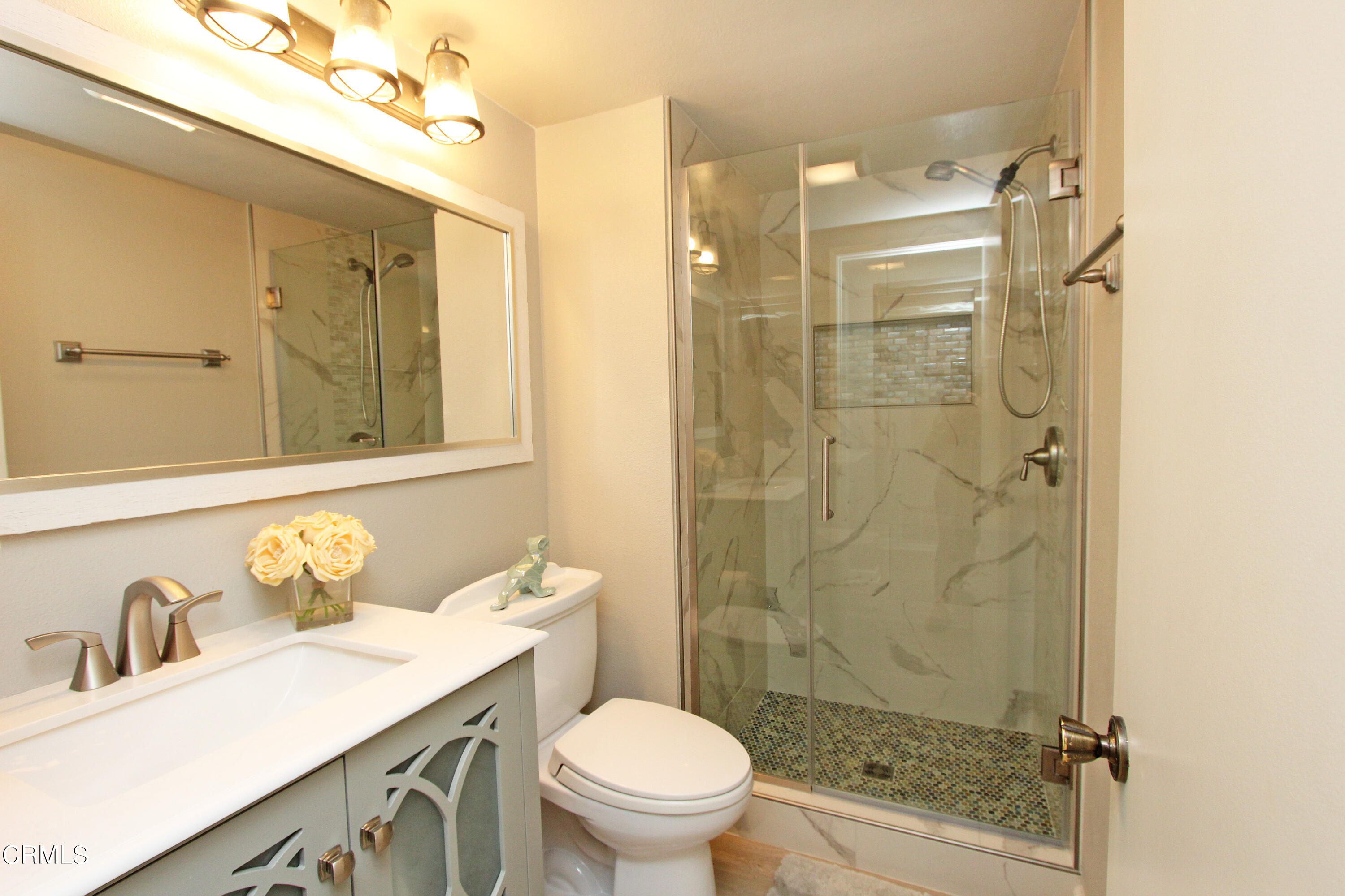 15030 Reedley Street, Unit C Moorpark, CA 93021 - Photo 20 of 51 a bathroom with a granite countertop sink toilet and shower