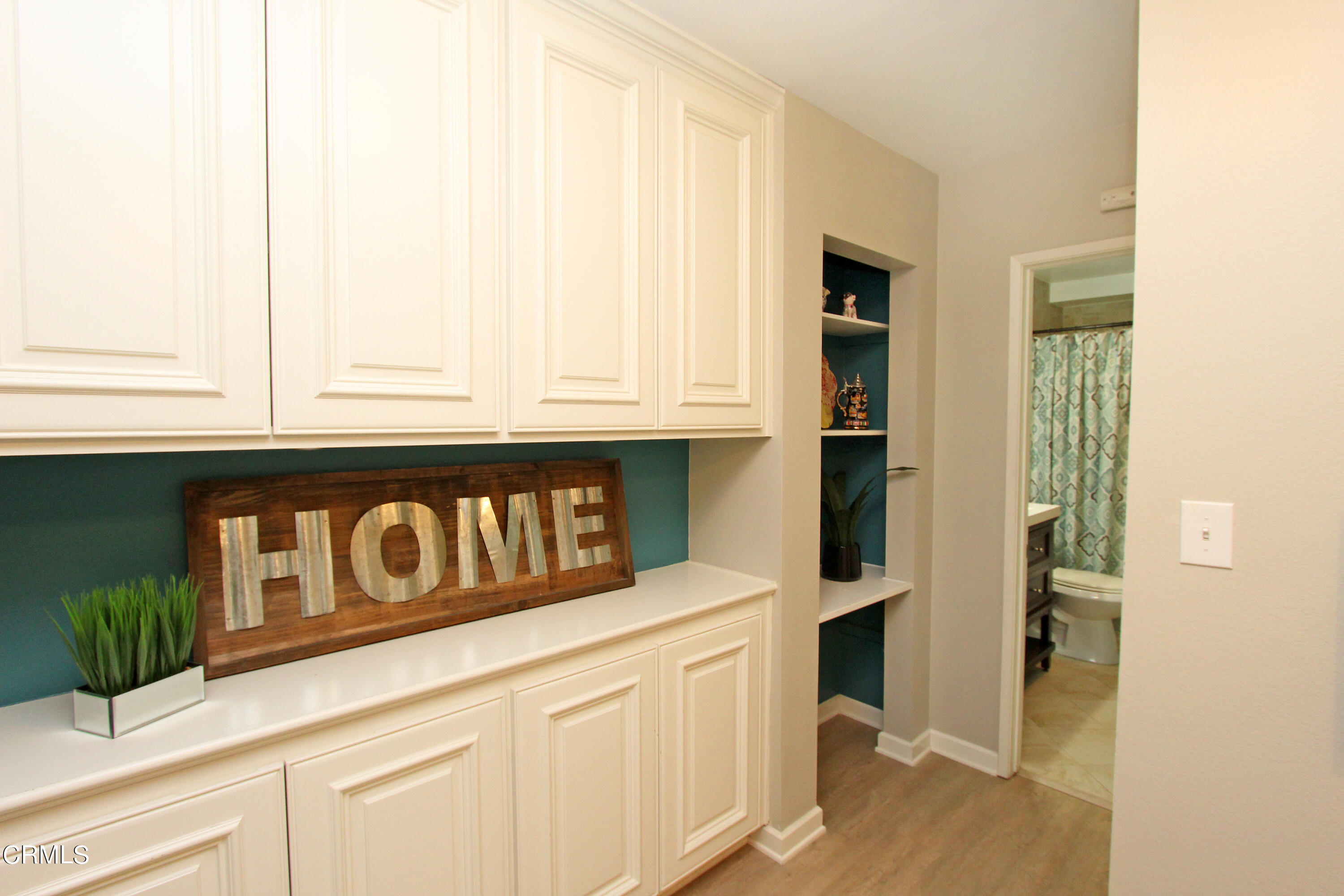 15030 Reedley Street, Unit C Moorpark, CA 93021 - Photo 22 of 51 a view of kitchen with granite countertop white cabinets and black appliances