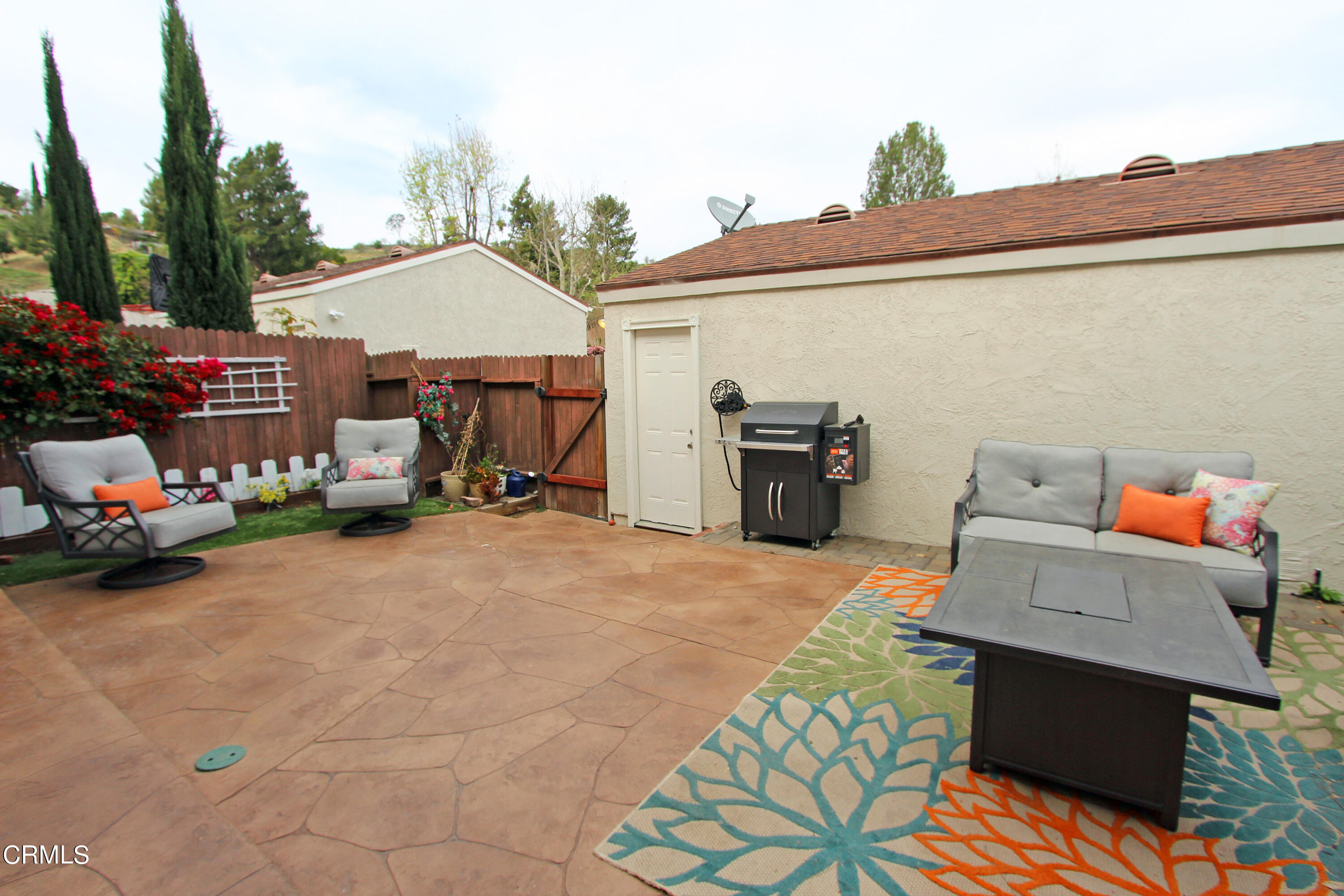 15030 Reedley Street, Unit C Moorpark, CA 93021 - Photo 44 of 51 a view of a patio with table and chairs