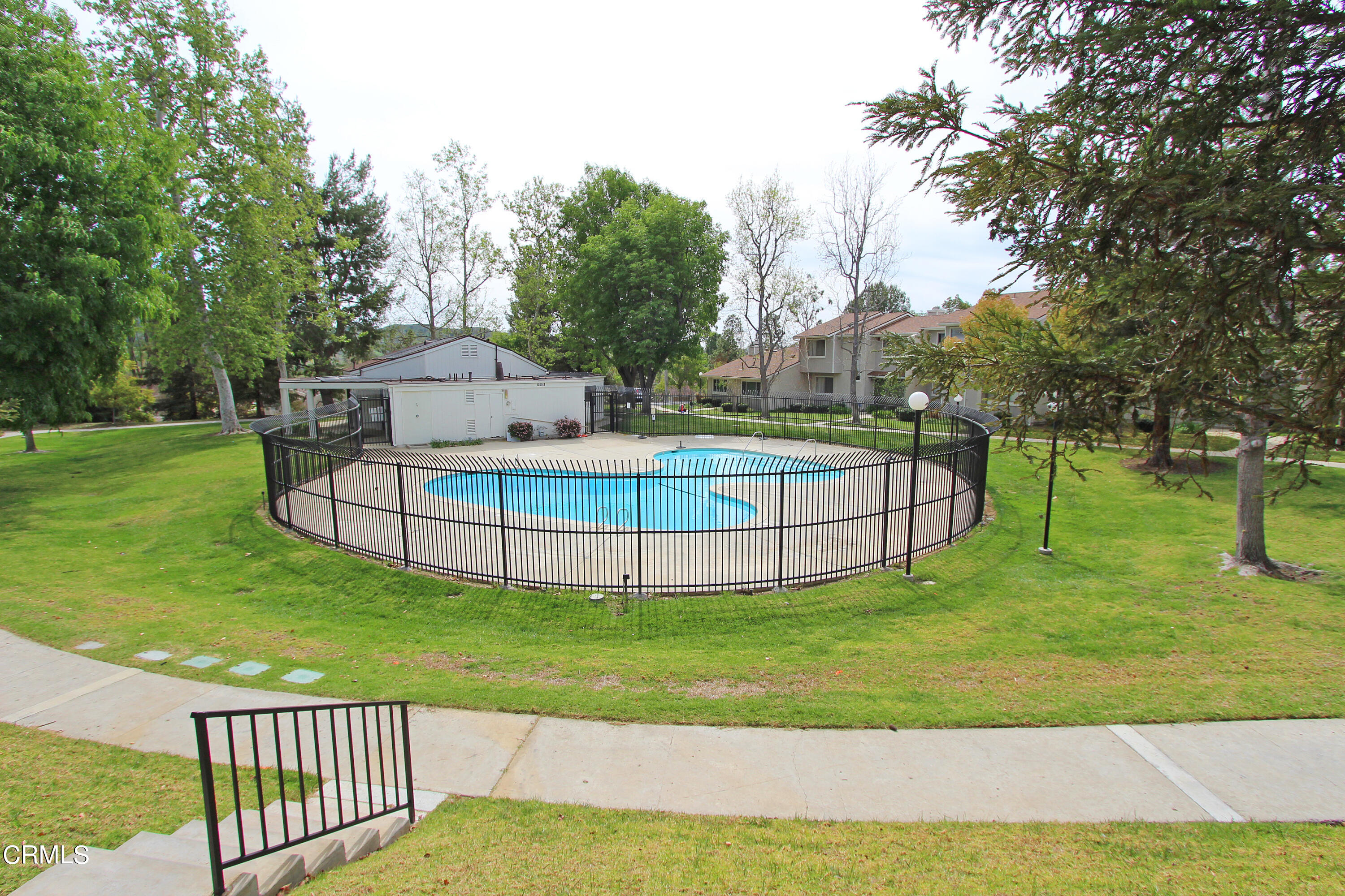 15030 Reedley Street, Unit C Moorpark, CA 93021 - Photo 46 of 51 a view of a house with a big yard and potted plants