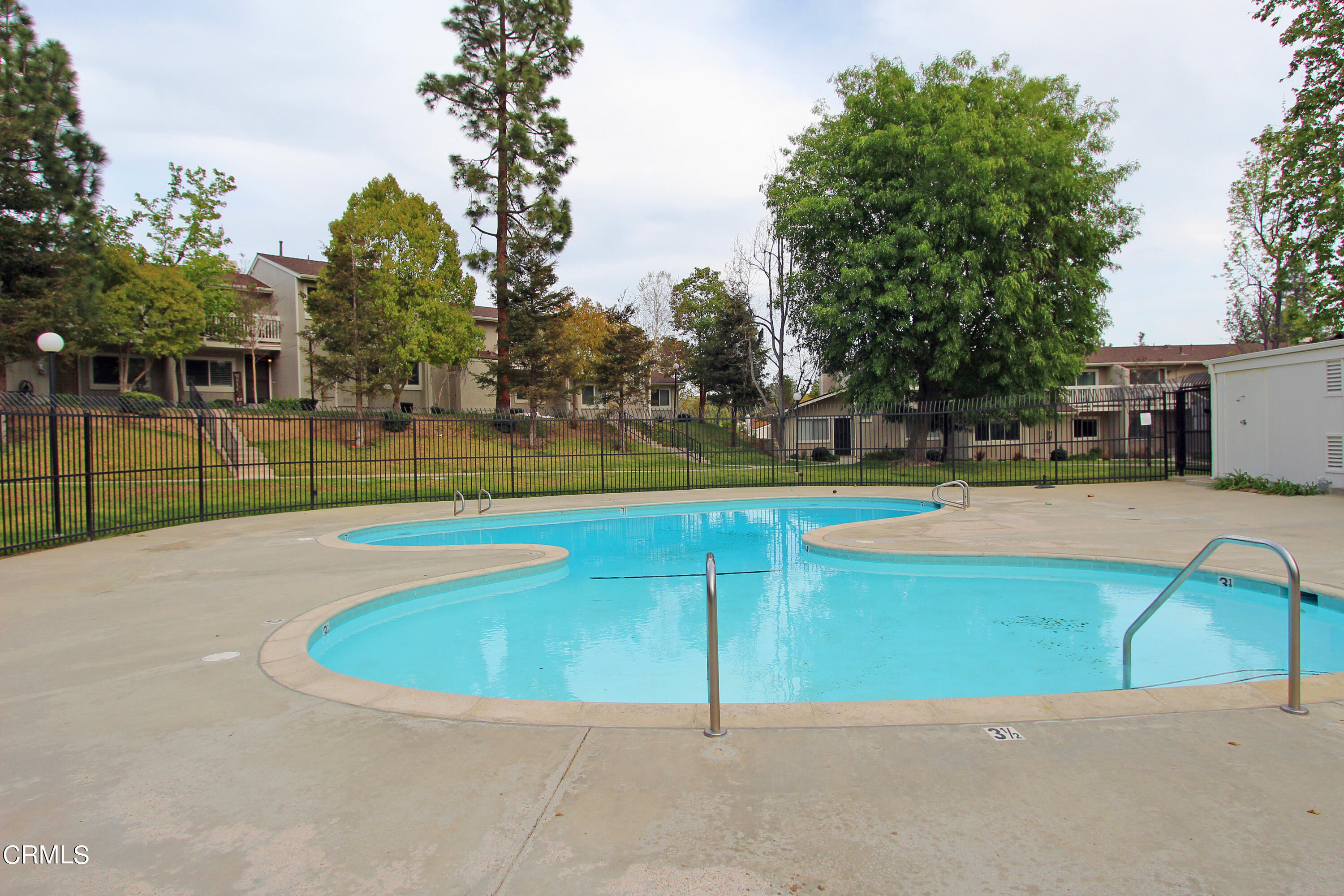 15030 Reedley Street, Unit C Moorpark, CA 93021 - Photo 48 of 51 a view of a swimming pool with an outdoor space and seating area