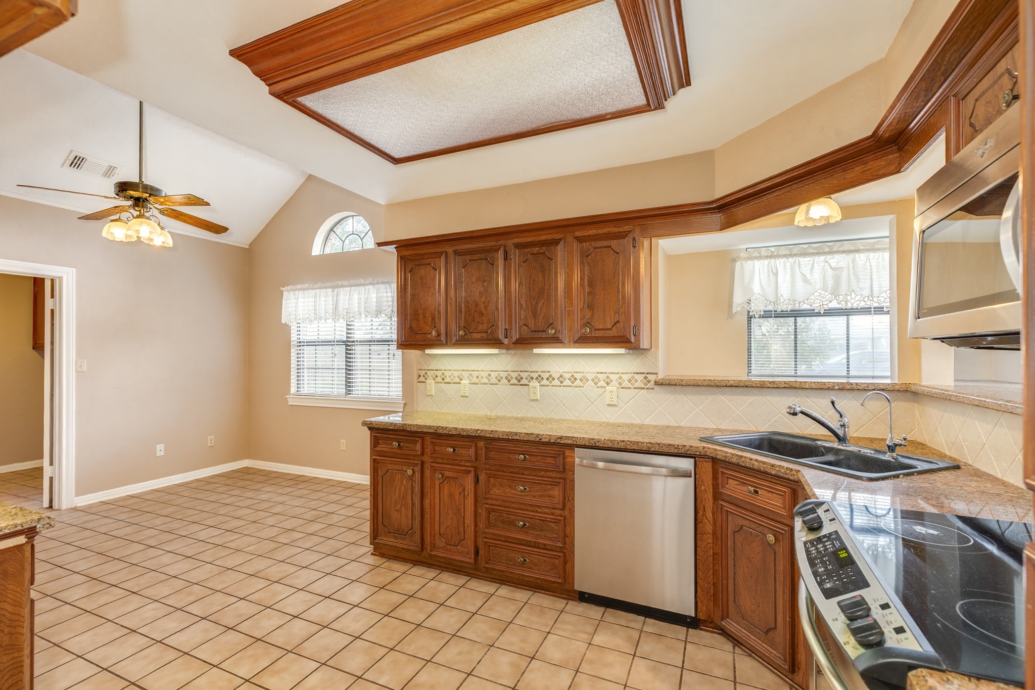 212 Any Way Street Lake Jackson, TX 77566 - Photo 16 of 28 a kitchen with a stove sink and cabinets