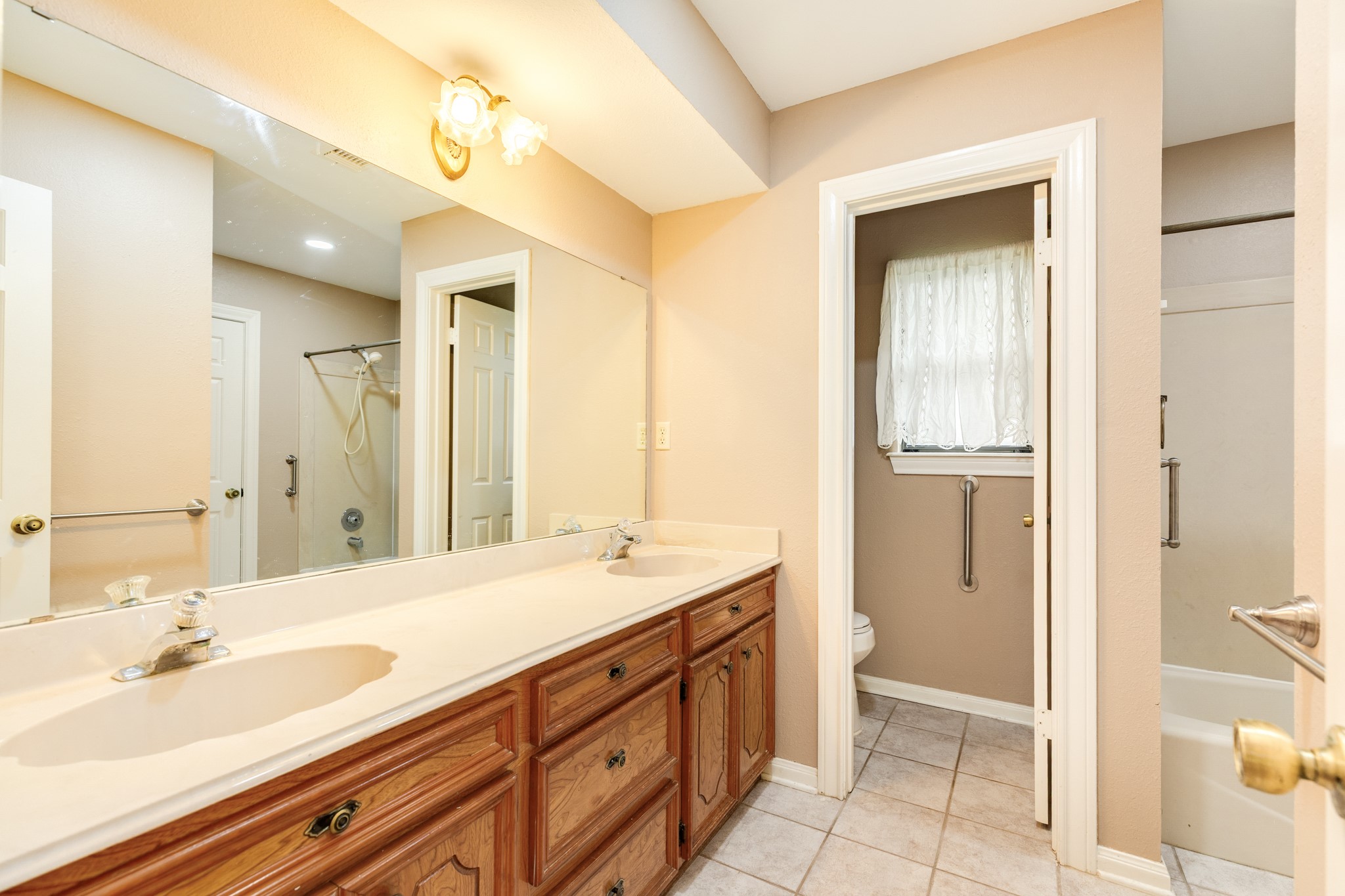 212 Any Way Street Lake Jackson, TX 77566 - Photo 19 of 28 a bathroom with a sink and a mirror