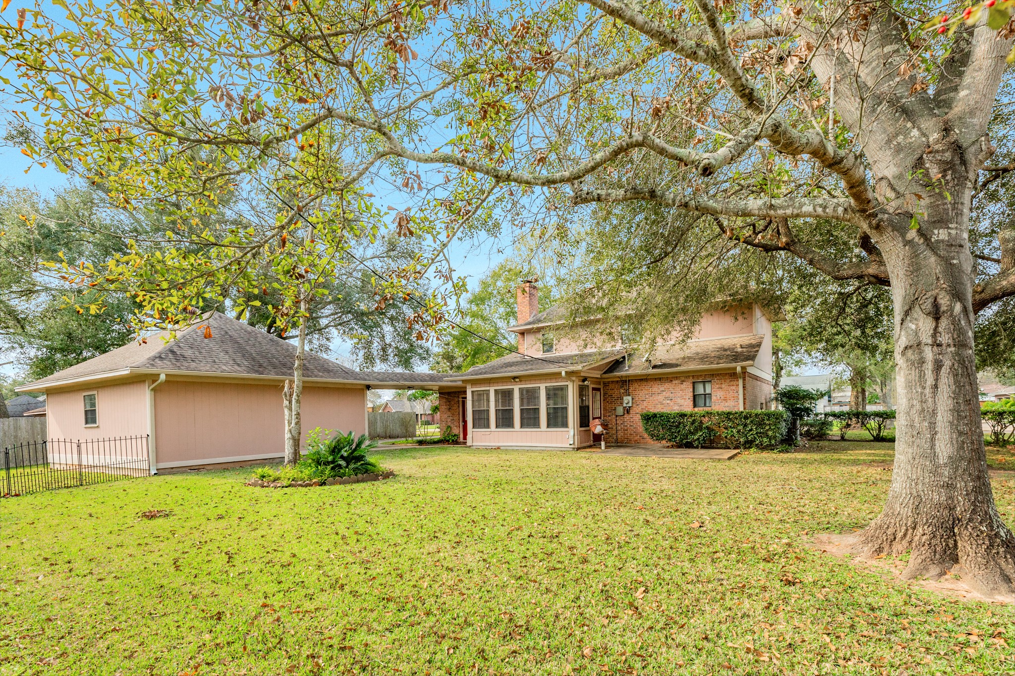 212 Any Way Street Lake Jackson, TX 77566 - Photo 2 of 28 a front view of a house with a yard