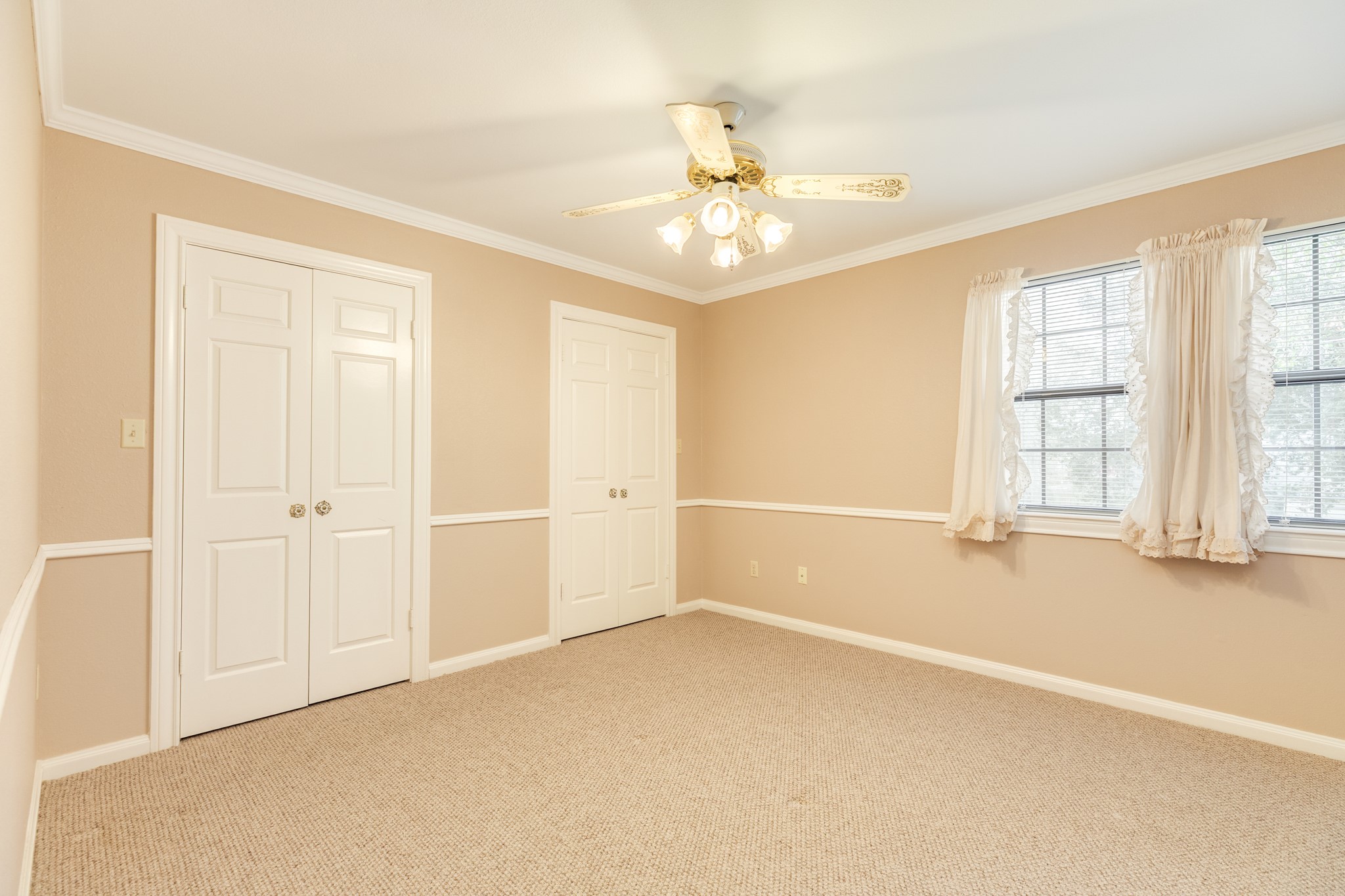 212 Any Way Street Lake Jackson, TX 77566 - Photo 22 of 28 wooden floor in an empty room with a window