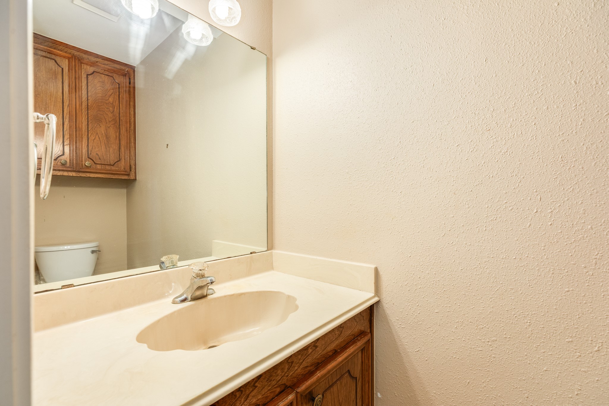 212 Any Way Street Lake Jackson, TX 77566 - Photo 26 of 28 a bathroom with a sink and a mirror
