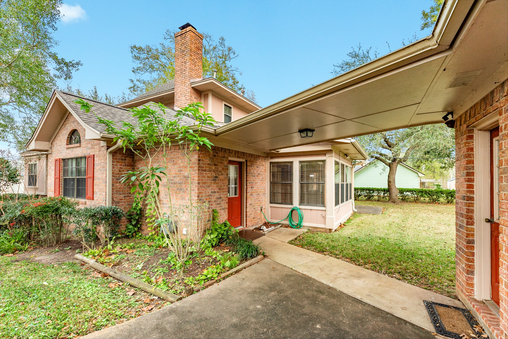 212 Any Way Street Lake Jackson, TX 77566 - Photo 27 of 28 a front view of a house with garden