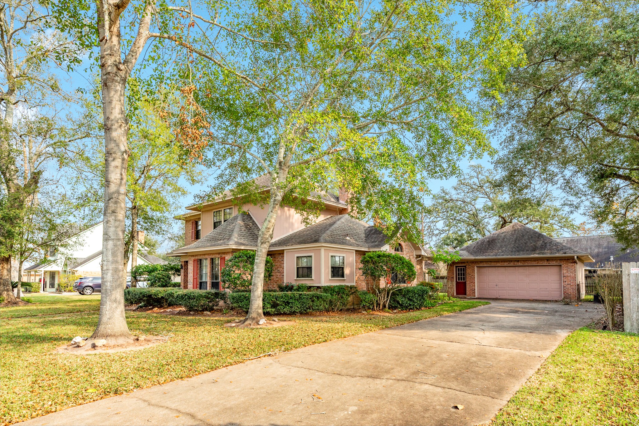 212 Any Way Street Lake Jackson, TX 77566 - Photo 8 of 28 a front view of a house with a yard and garage