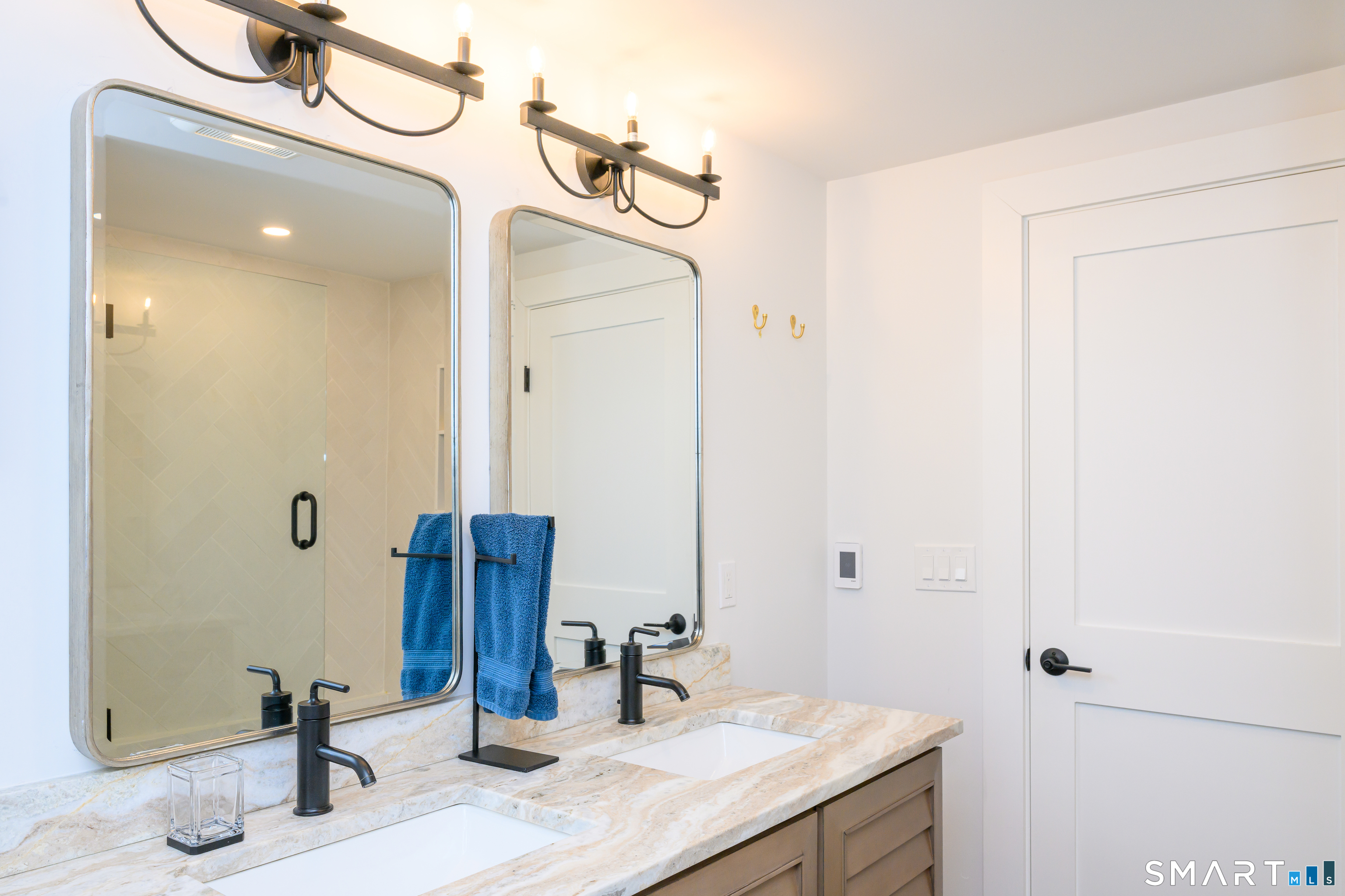 8 East Wharf Road Waterford, CT 06385 - Photo 23 of 40 a bathroom with a granite countertop sink and a mirror
