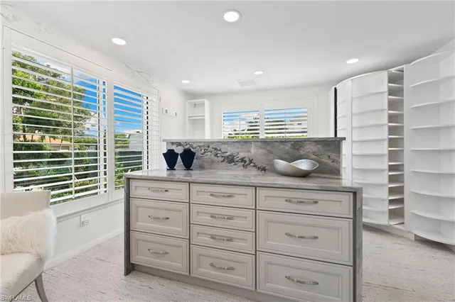 a kitchen with a cabinets and window