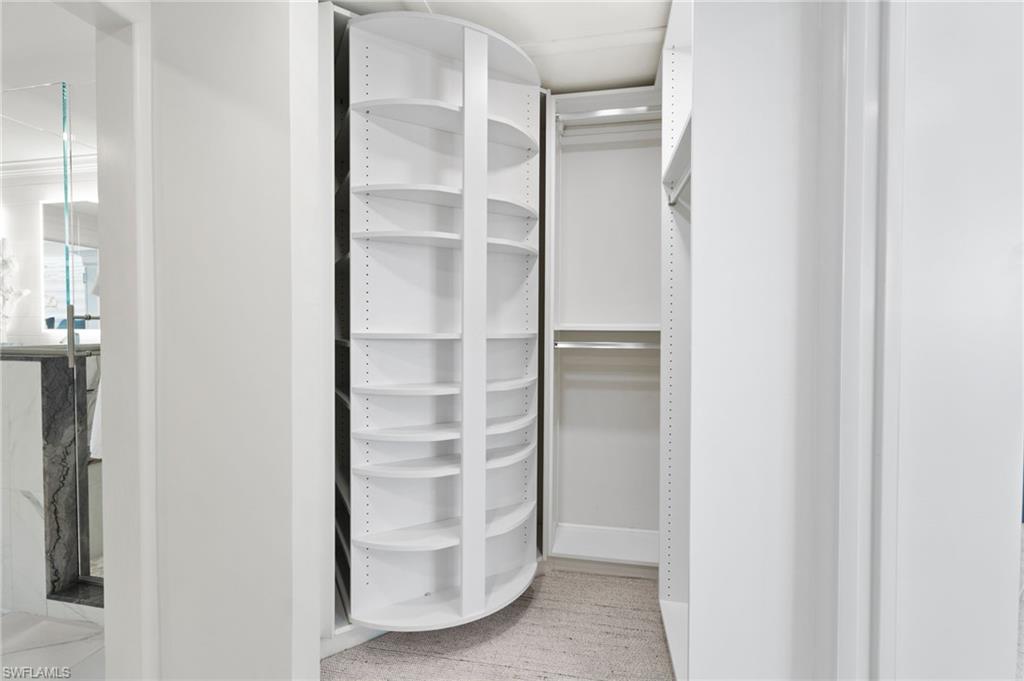 3737 Crayton Road Naples, FL 34103 - Photo 16 of 33 a view of closet area with empty racks