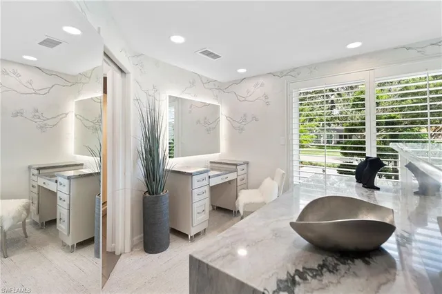a kitchen with a sink stainless steel appliances and cabinets