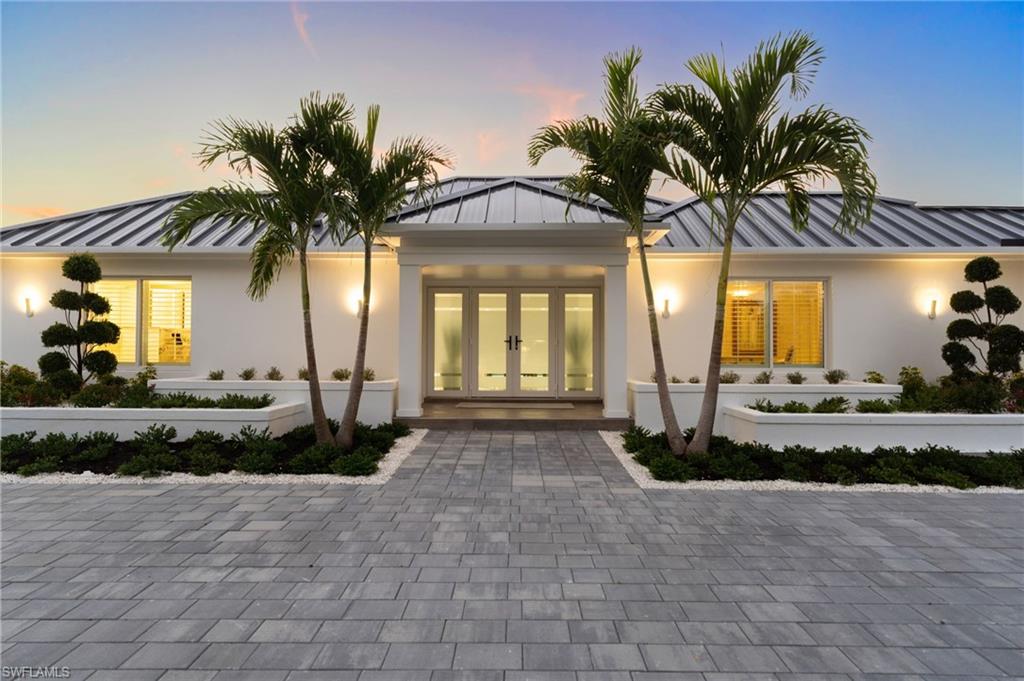 3737 Crayton Road Naples, FL 34103 - Photo 4 of 33 a view of a house with a patio