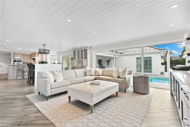 a living room with furniture and a table