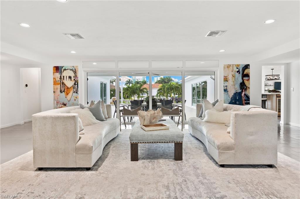 3737 Crayton Road Naples, FL 34103 - Photo 8 of 33 a living room with furniture and a large window