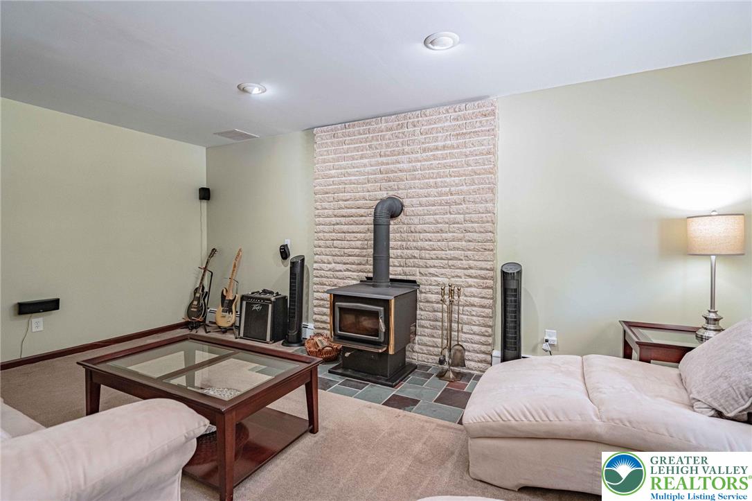 3857 Friedens Road Slatington, PA 18080 - Photo 23 of 75 This inviting room features a prominent fireplace, creating a cozy and warm ambiance.