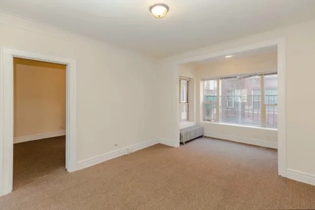 a view of an empty room with a window