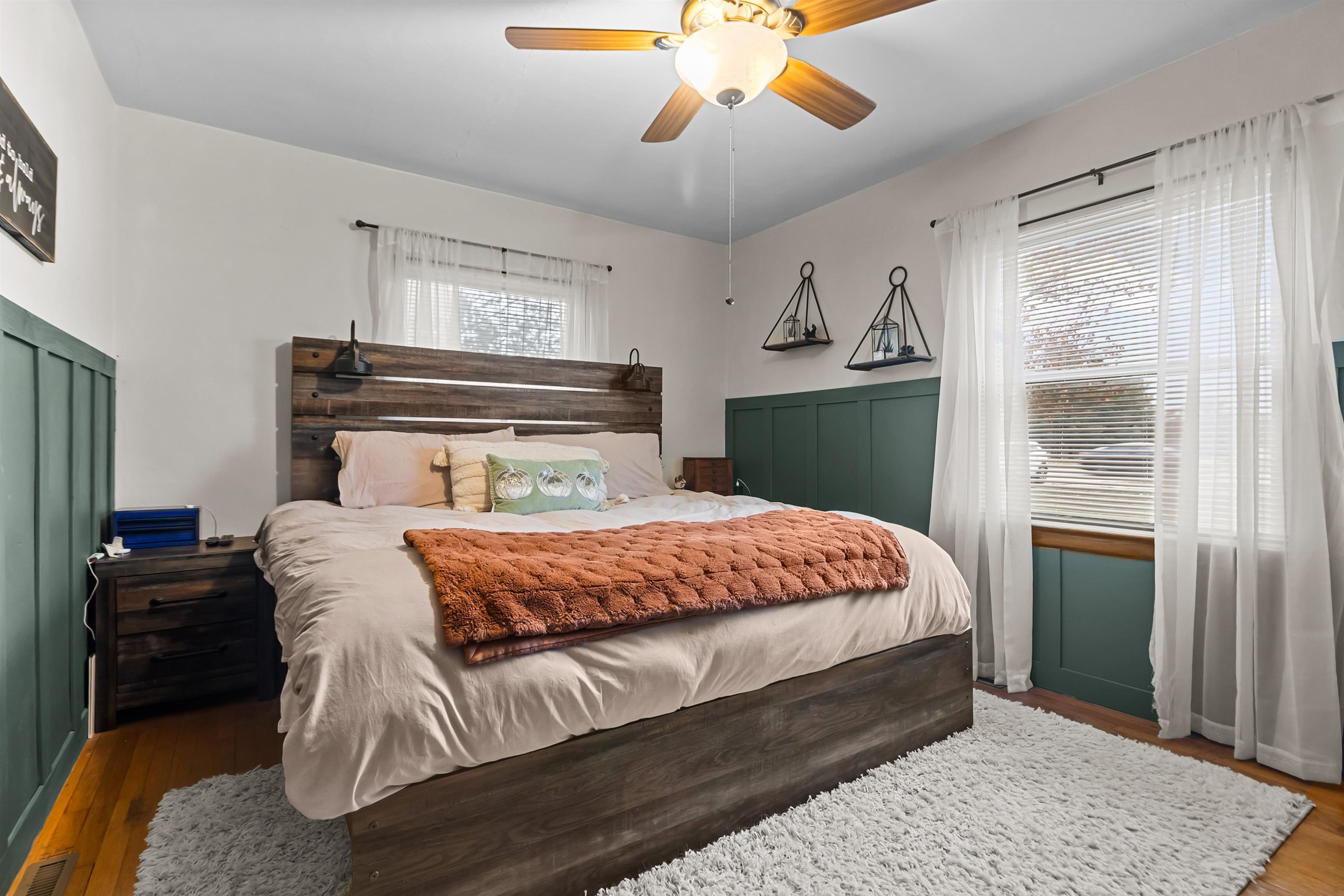 108 East Grove Street Poplar Grove, IL 61065 - Photo 15 of 30 a bedroom with a large bed and a chandelier