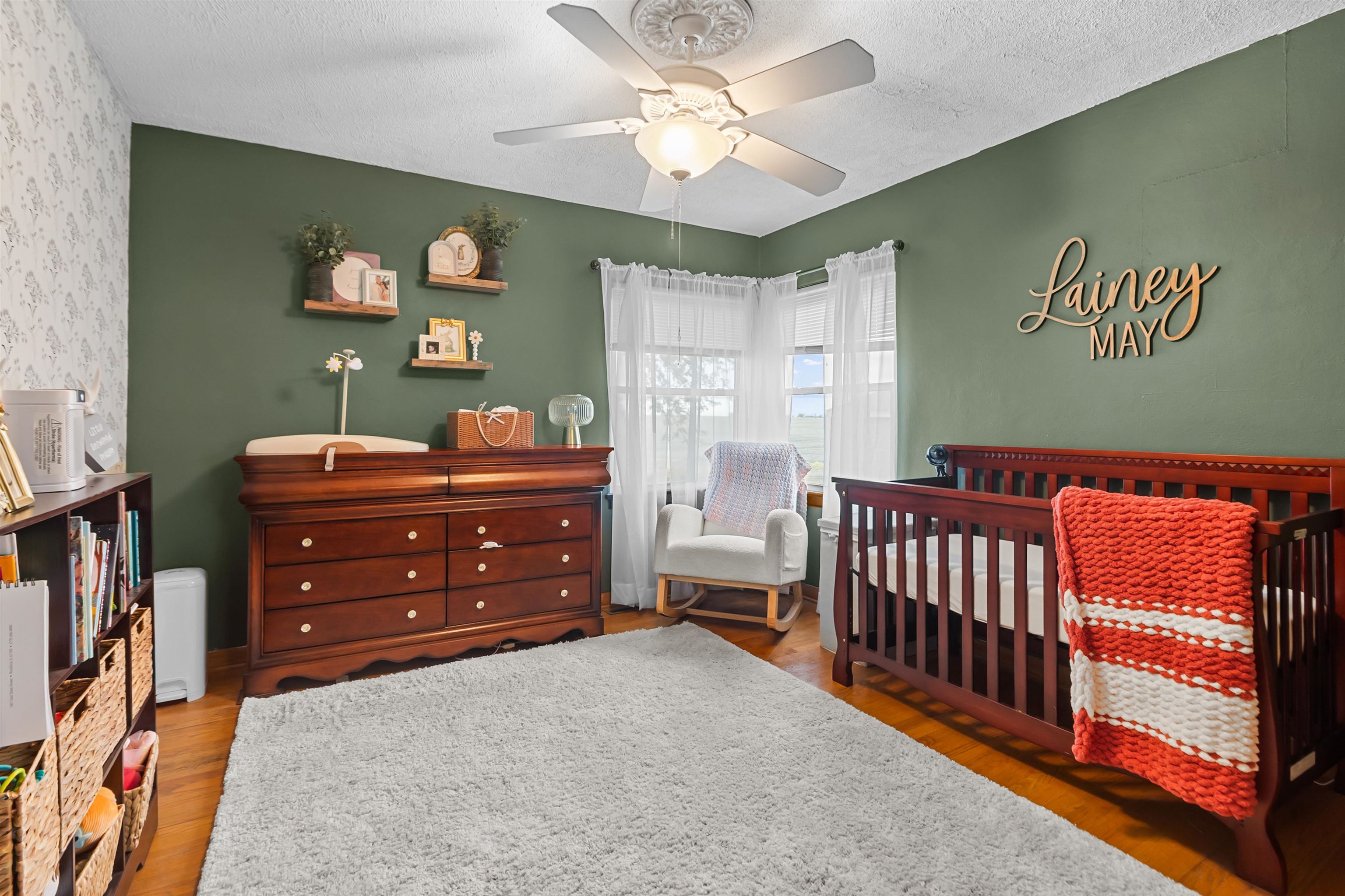 108 East Grove Street Poplar Grove, IL 61065 - Photo 18 of 30 a bedroom with a bed and a chandelier
