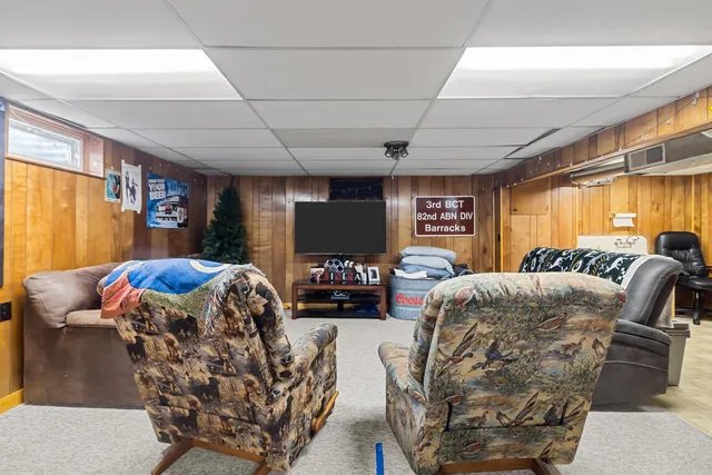 a view of a livingroom with furniture and a fireplace