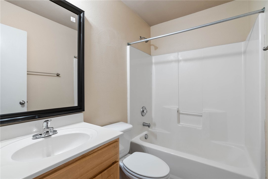 6606 Riding Wind Drive Corpus Christi, TX 78414 - Photo 10 of 15 a bathroom with a sink toilet and shower