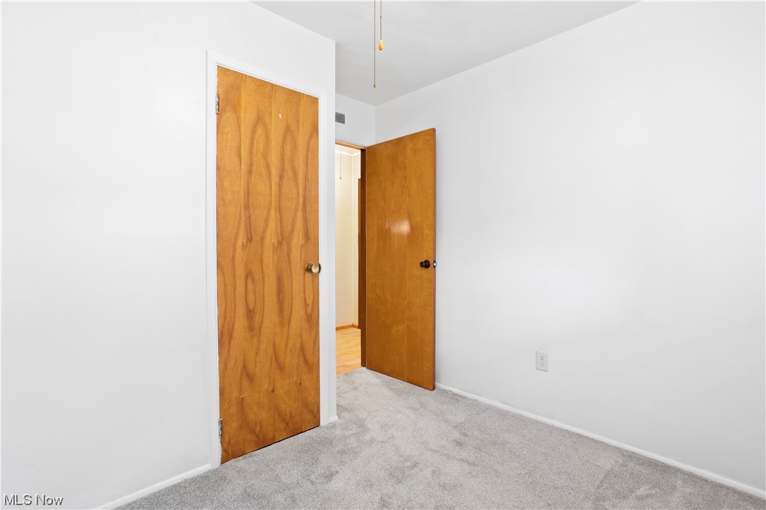 387 Fairfax Road Vermilion, OH 44089 - Photo 26 of 35 Spare room featuring light carpet