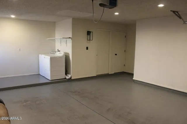 a view of a storage & utility room with a sink