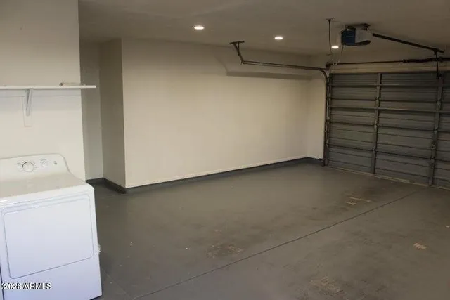 a view of storage and utility room with washer and dryer