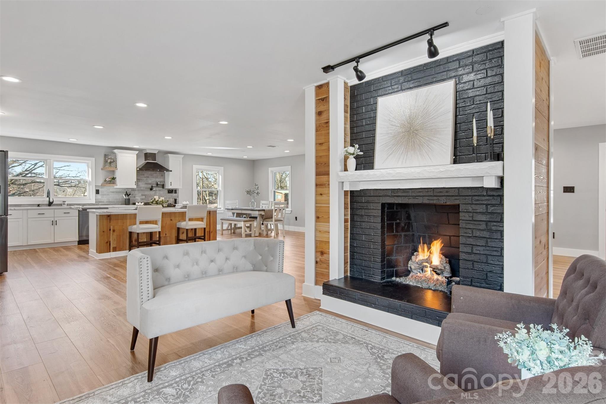 1206 9th Street Northwest Hickory, NC 28601 - Photo 15 of 40 a living room with furniture and a fireplace
