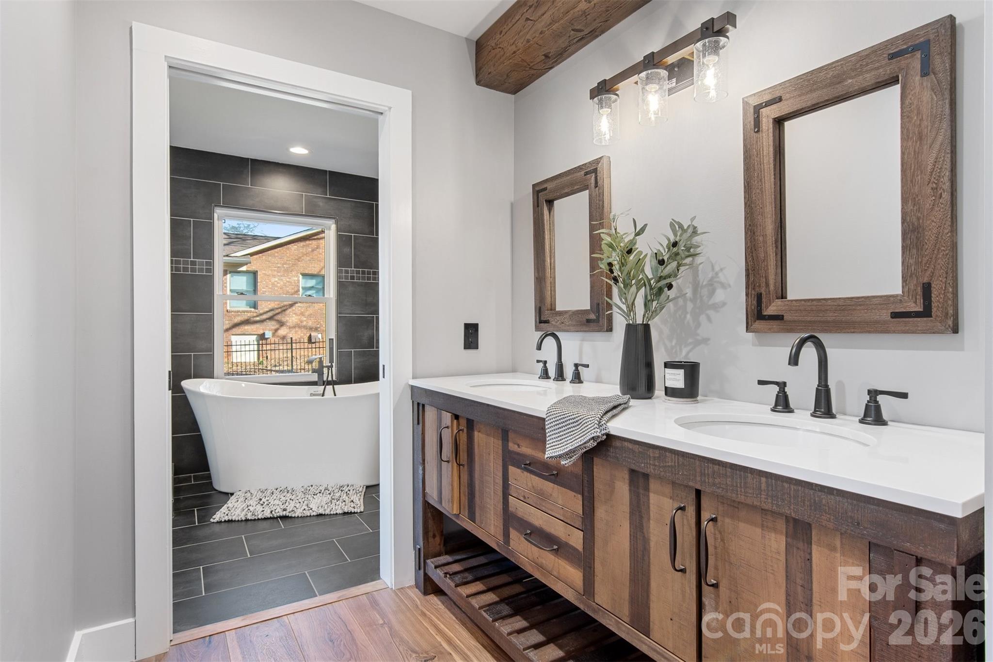 1206 9th Street Northwest Hickory, NC 28601 - Photo 19 of 40 a spacious bathroom with a double vanity sink and a mirror