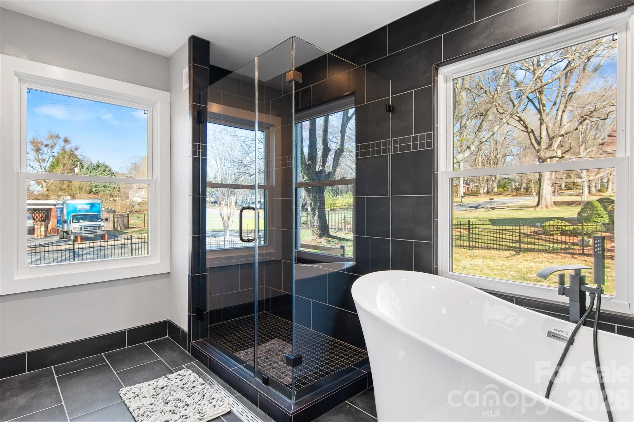 1206 9th Street Northwest Hickory, NC 28601 - Photo 21 of 40 a bathroom with a bathtub and a shower