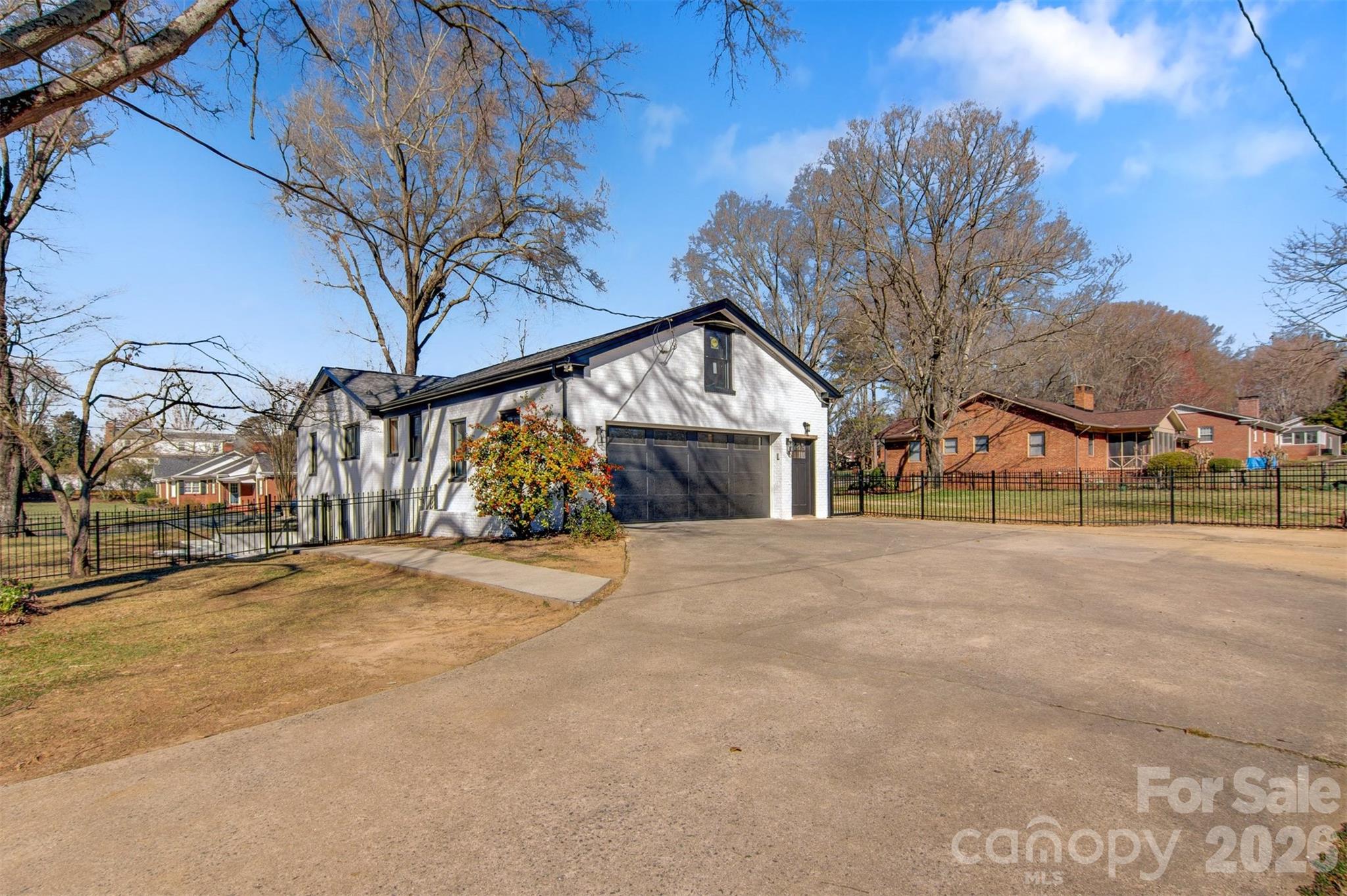 1206 9th Street Northwest Hickory, NC 28601 - Photo 39 of 40 a view of large house with a road and big trees