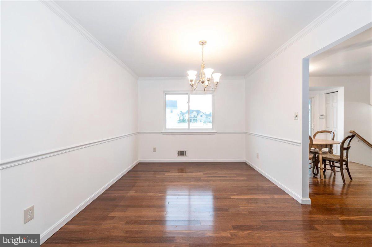 19924 Westerly Avenue Poolesville, MD 20837 - Photo 12 of 80 wooden floor in an empty room with window