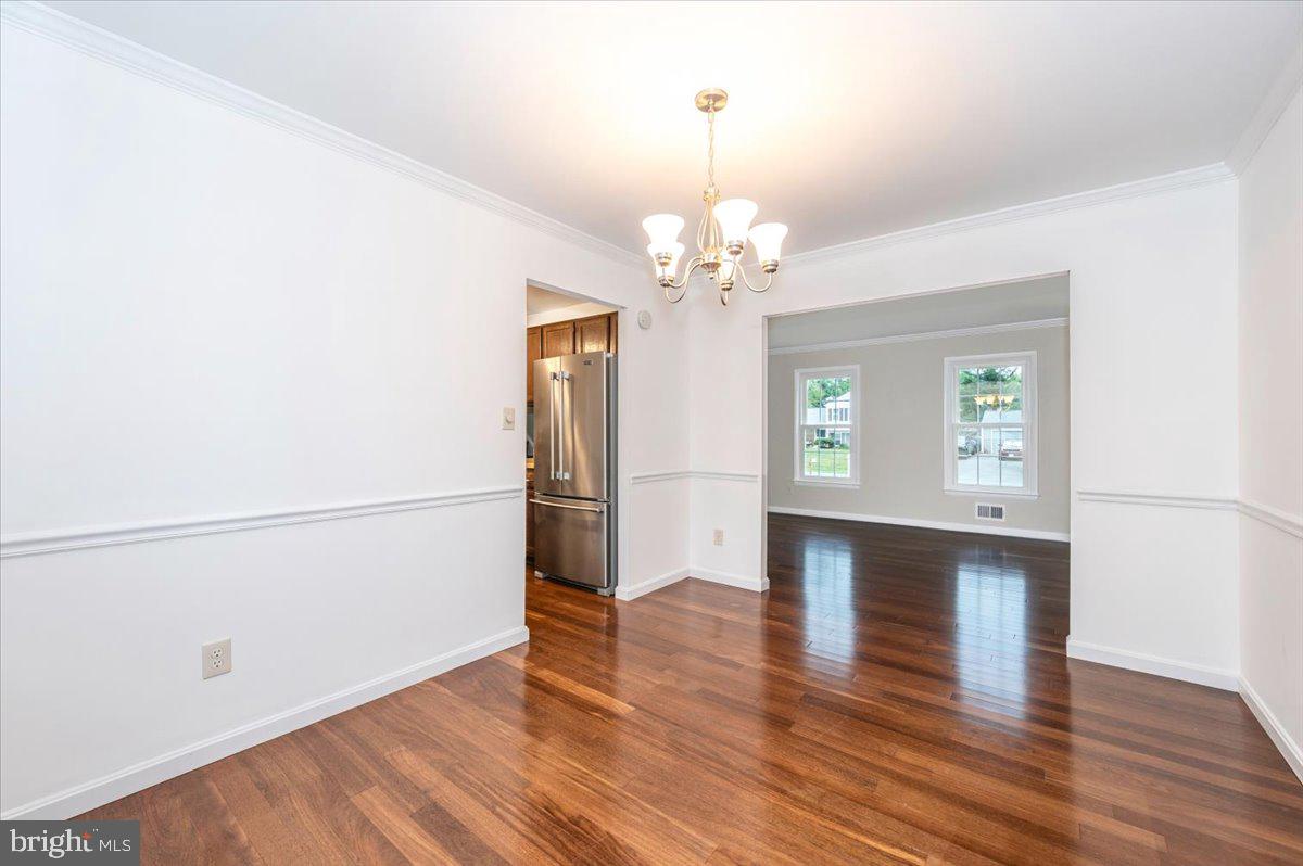 19924 Westerly Avenue Poolesville, MD 20837 - Photo 13 of 80 a view of livingroom with hardwood floor and kitchen view