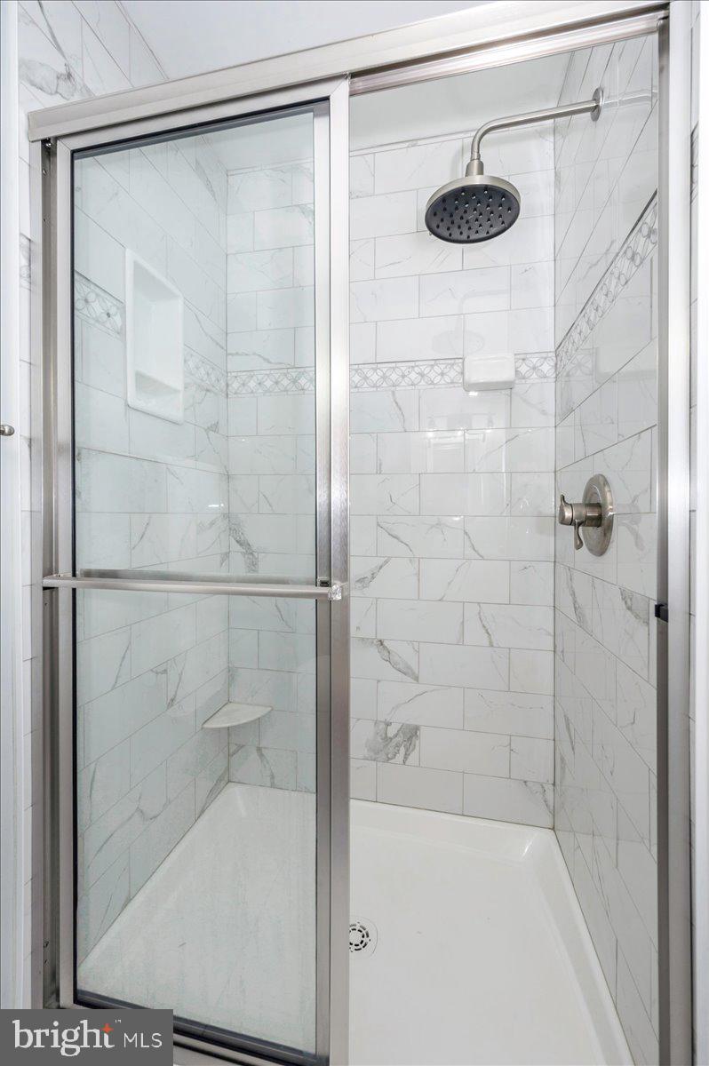 19924 Westerly Avenue Poolesville, MD 20837 - Photo 25 of 80 a bathroom with a shower and a sink