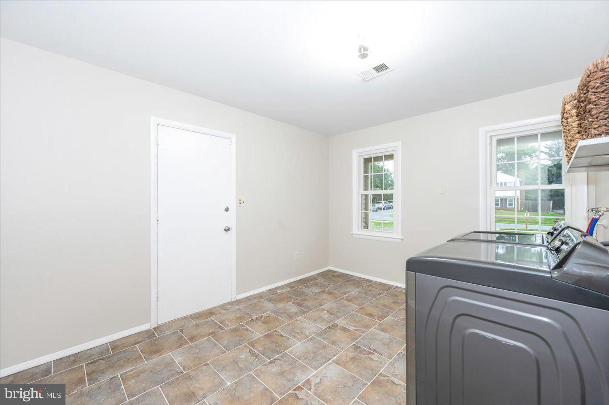 19924 Westerly Avenue Poolesville, MD 20837 - Photo 41 of 80 a bedroom with a bed and a window