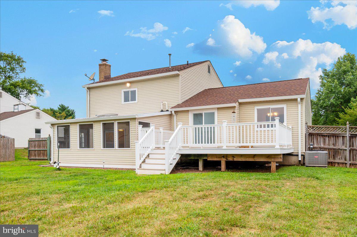 19924 Westerly Avenue Poolesville, MD 20837 - Photo 45 of 80 a view of a house with a backyard
