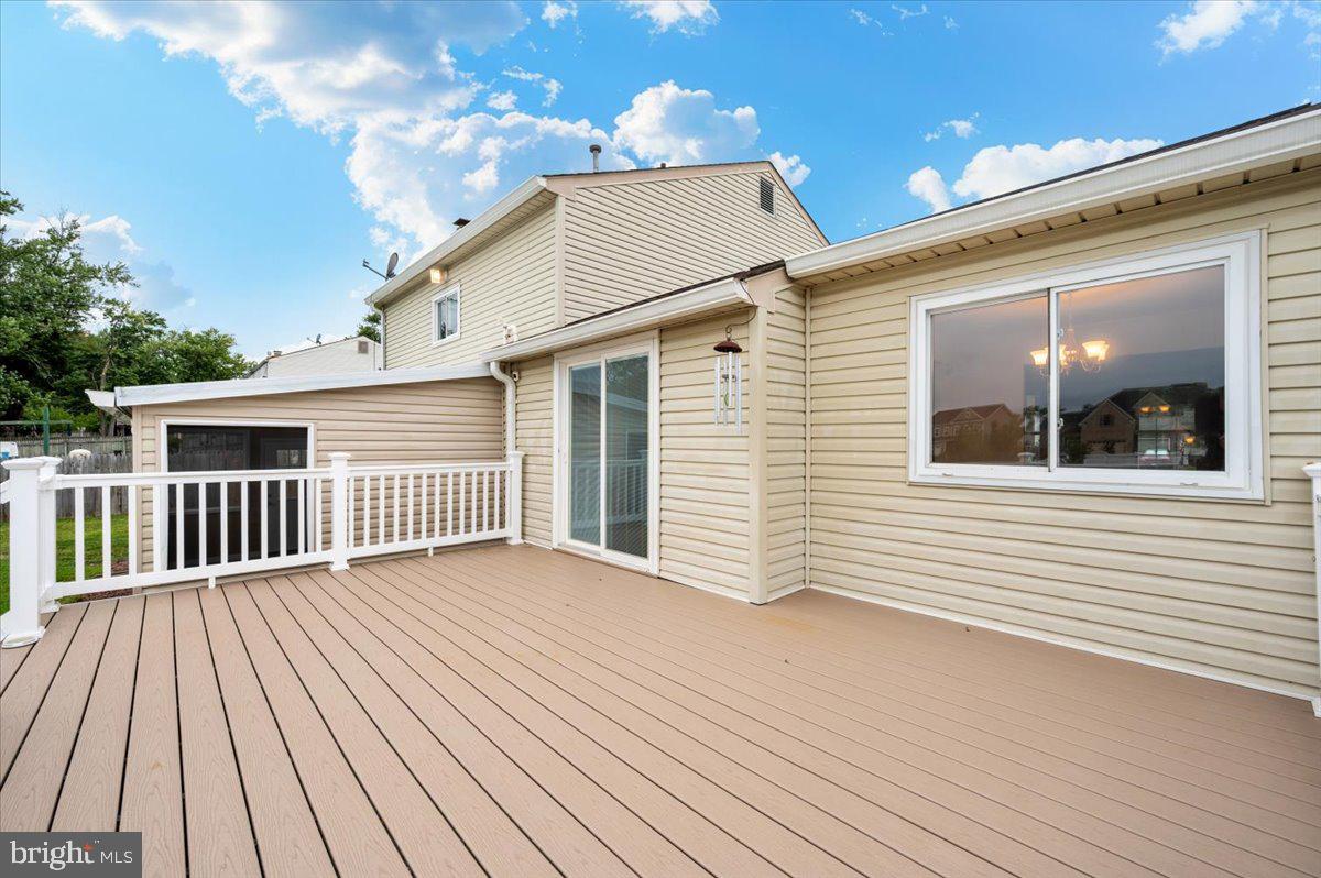 19924 Westerly Avenue Poolesville, MD 20837 - Photo 48 of 80 a view of a house with wooden deck