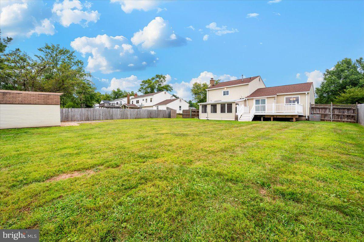 19924 Westerly Avenue Poolesville, MD 20837 - Photo 50 of 80 a view of a house with a big yard and large trees
