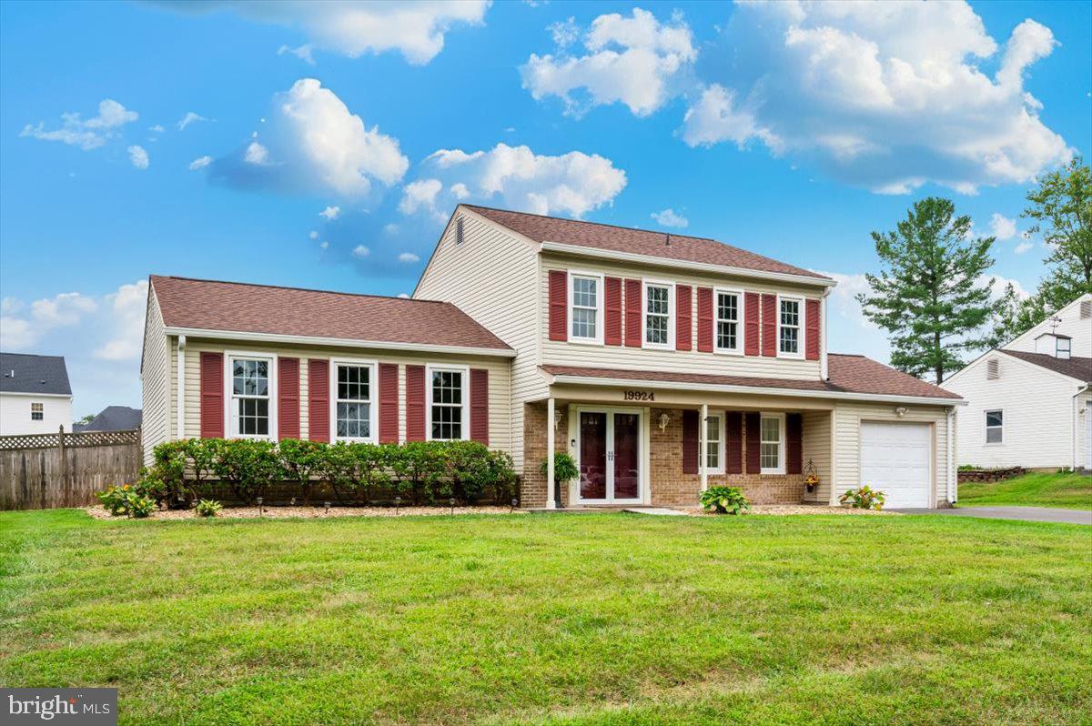 19924 Westerly Avenue Poolesville, MD 20837 - Photo 53 of 80 a front view of a house with a garden