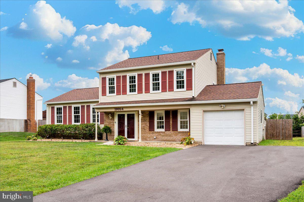 19924 Westerly Avenue Poolesville, MD 20837 - Photo 55 of 80 a front view of a house with garden