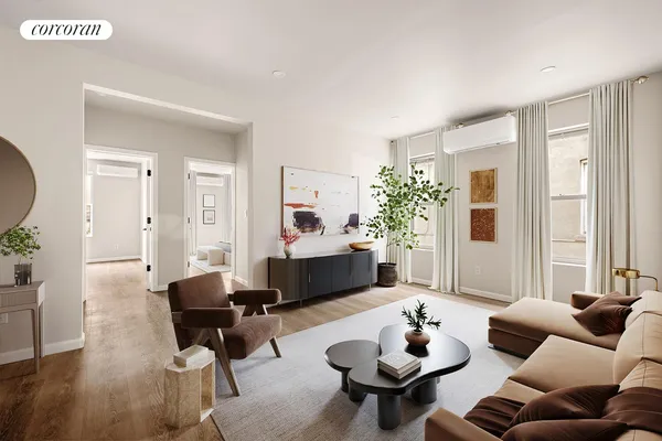 a living room with furniture and a wooden floor