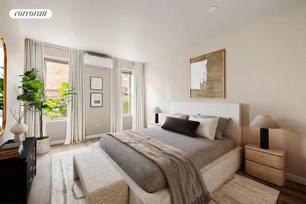 a bedroom with a large bed and a potted plant
