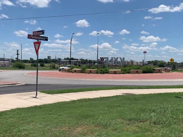 1503 North Burleson Street Kyle, TX 78640 - Photo 2 of 11 View of Round-about at Burleson St & Marketplace Ave. 1 block from subject