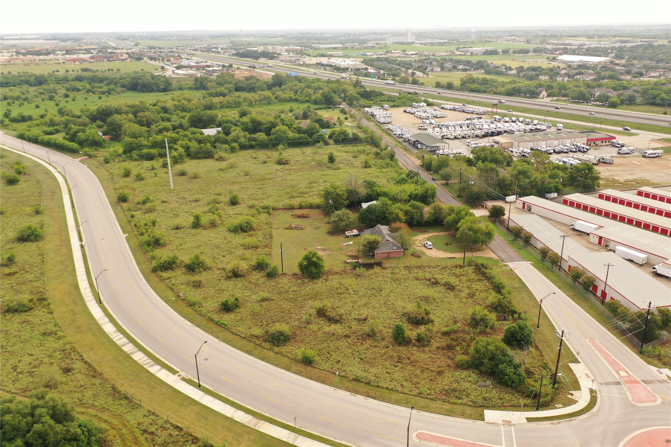 1503 North Burleson Street Kyle, TX 78640 - Photo 4 of 11 aerial view showing the subject 1 acre and surrounding land