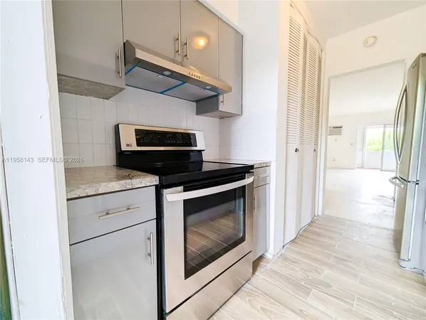 a kitchen with a stove and a microwave