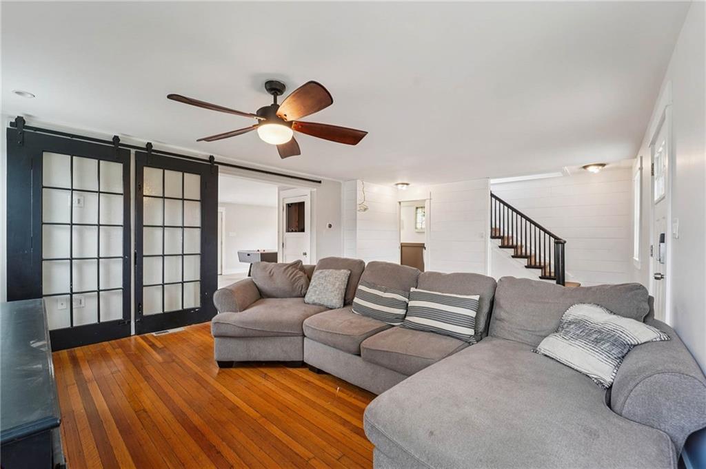 6012 Cunningham Road Gibsonia, PA 15044 - Photo 4 of 26 a living room with furniture and a ceiling fan
